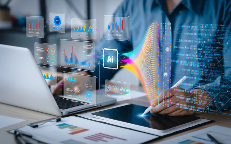 Webinar: Uplifting our Community Voices 3 Person using AI tools and data visualizations on a laptop and tablet