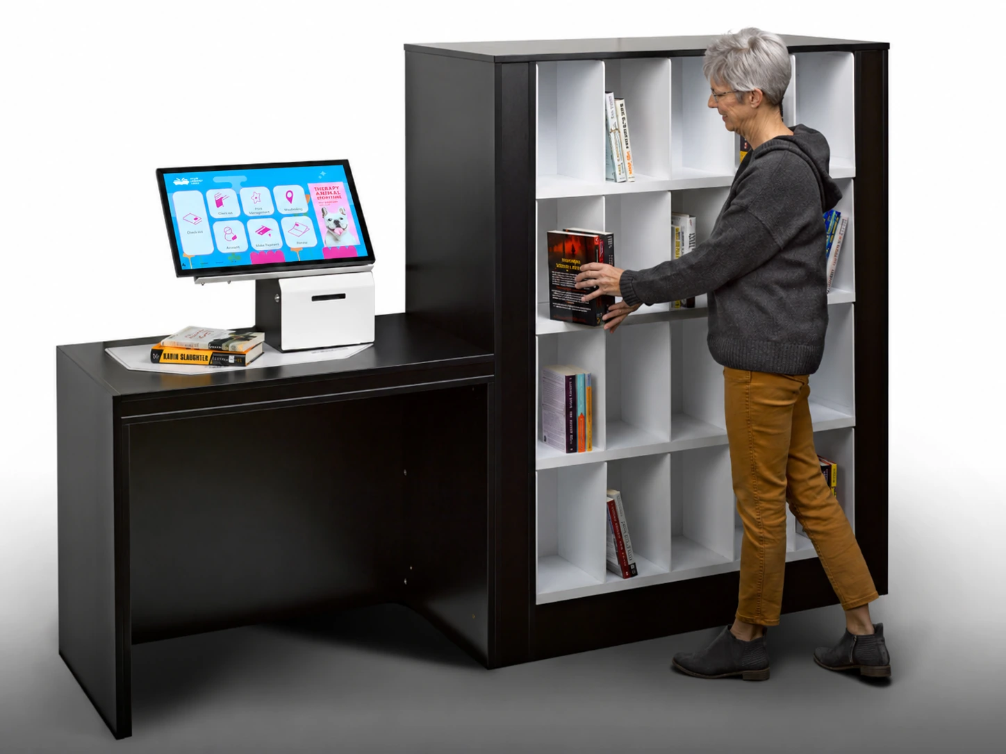 La RFID, une technologie qui aide les bibliothèques à renforcer leur impact 4 Library user returning a book to Bibliotheca smartShelf borrow with integrated selfCheck.