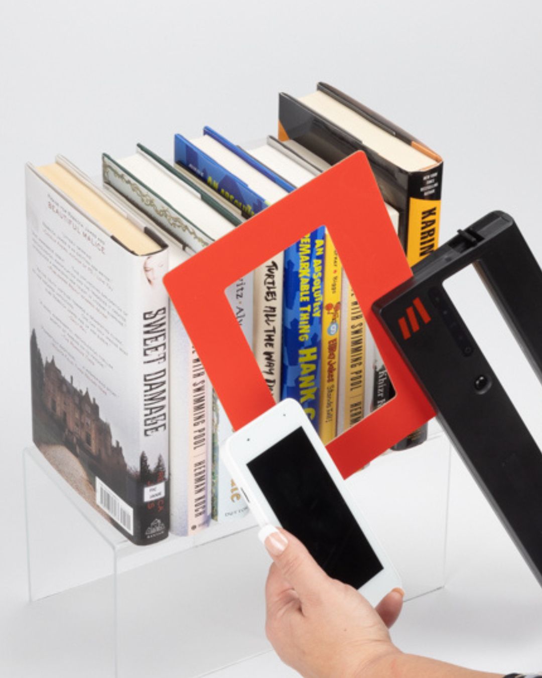 Library staff performing RFID inventory using a mobile scanning device