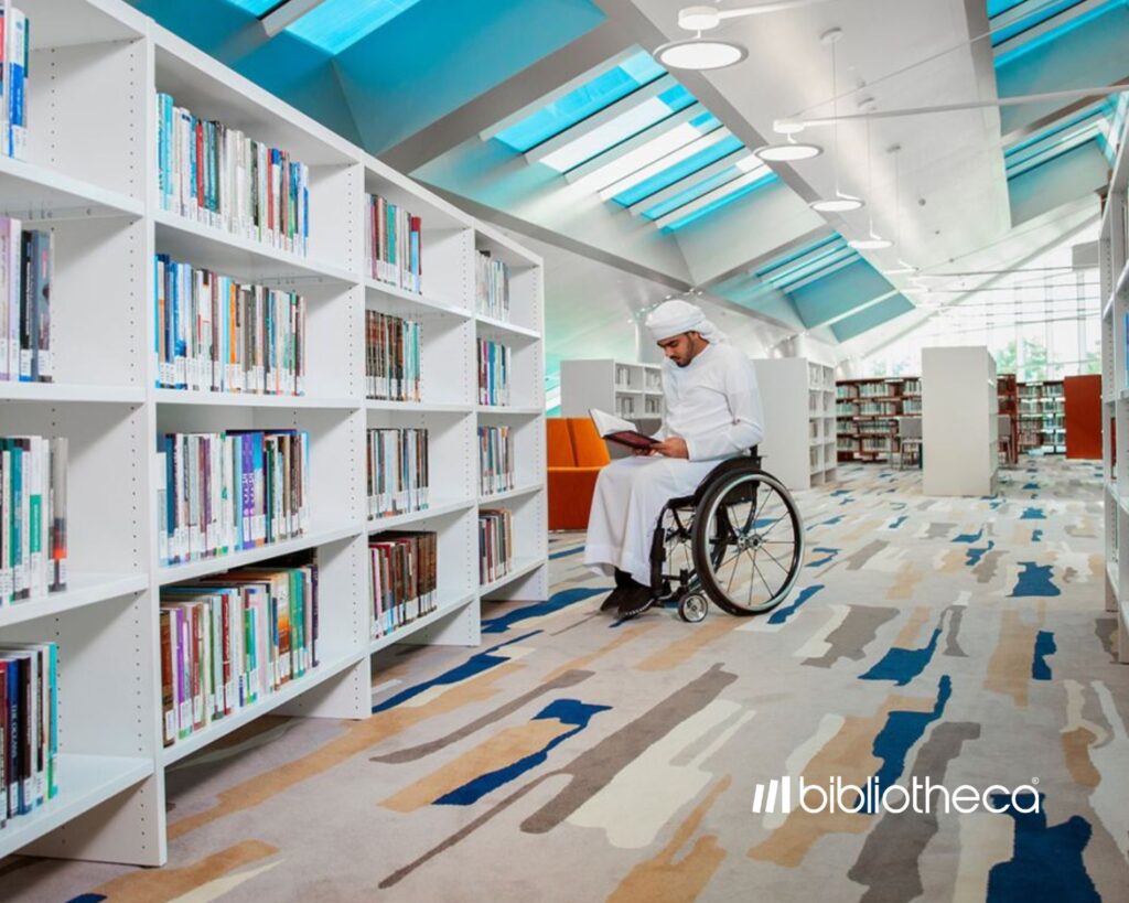 The image shows a man on a chairwheel in the library. For visually impaired readers, the library offers braille books as well as quiet reading pods for visitors with special needs. This commitment to inclusivity ensures that all patrons can equally enjoy the library's resources. And further underscoring the library’s commitment to accessibility.