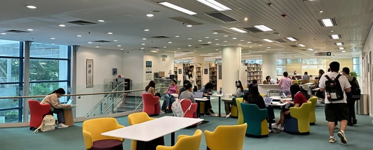 Students and visitors gathering in an open area of HKMU Library