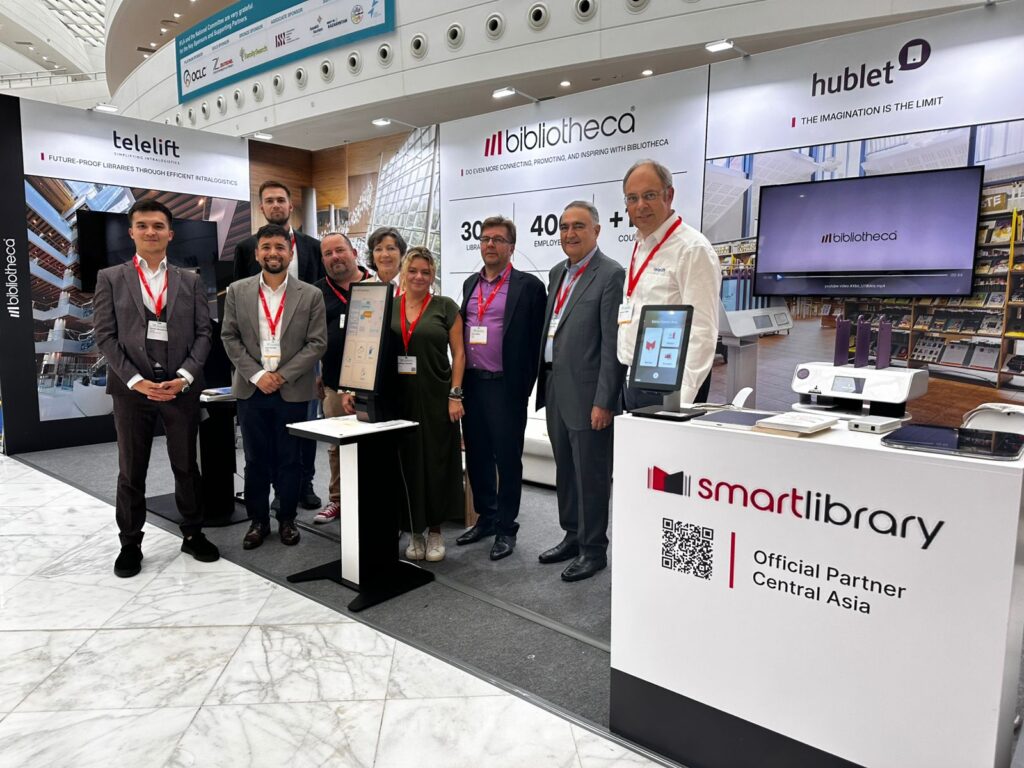 Bibliotheca, SmartLibrary, Hublet and Telelift team at IFLA 2025 booth showcasing innovative library solutions in Central Asia.