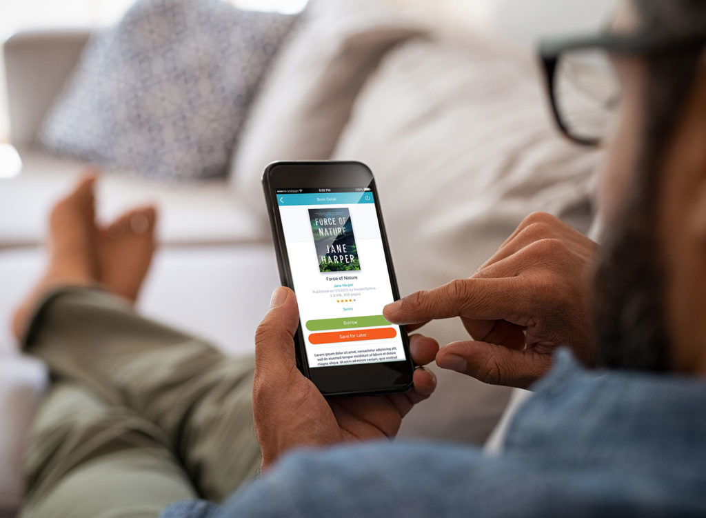 Man borrowing ebook from cloudLibrary app