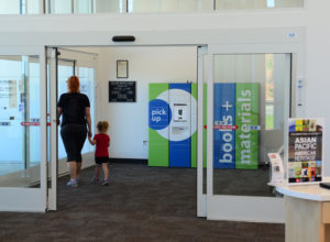 Mother and son walking out of Toledo library branch