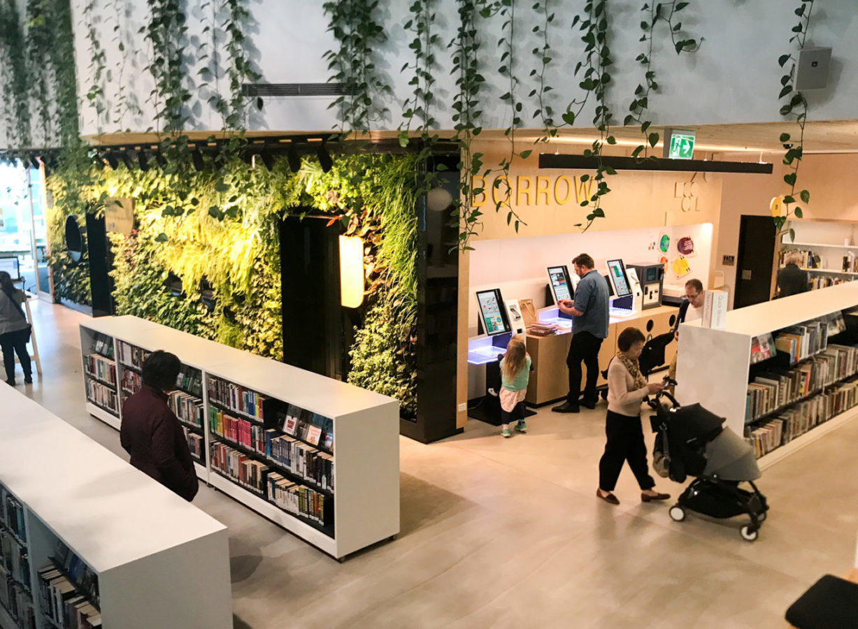 SelfCheck1000 in library with leaf wall and a jungle outdoor theme