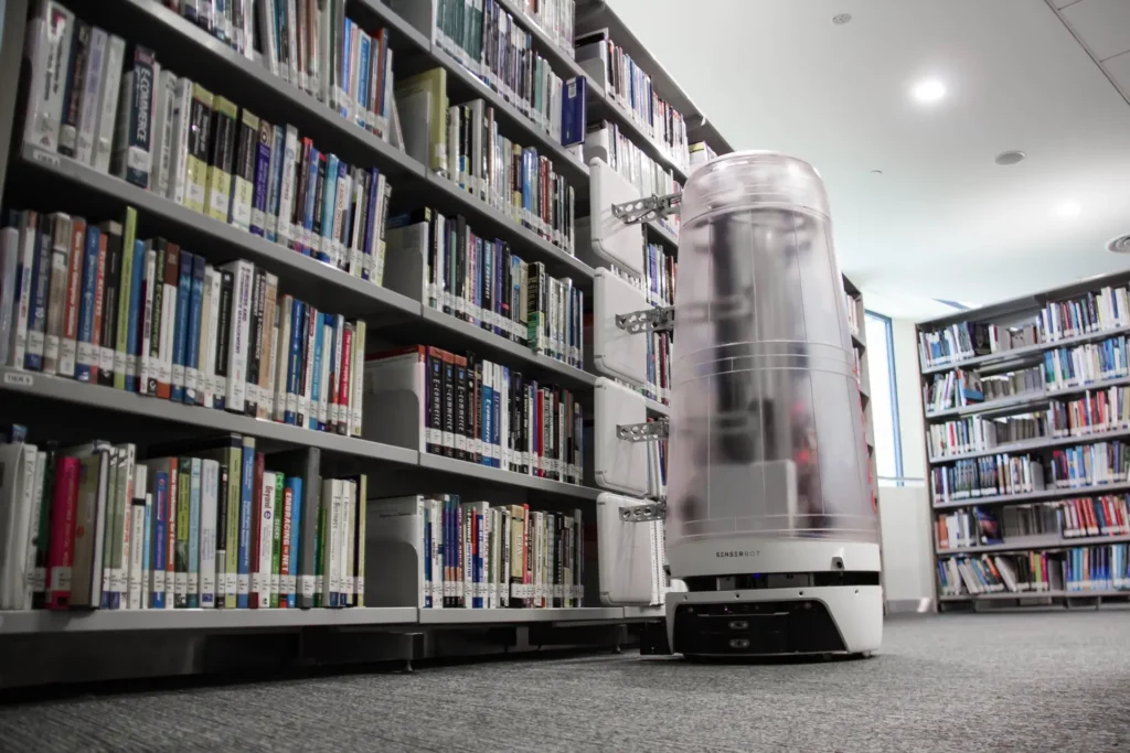 Senserbot autonomous robot moving through library stacks to support inventory and automation