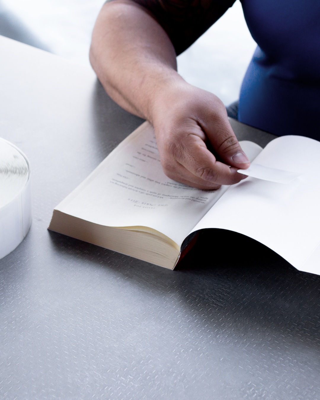 Applying an RFID tag to a library book for collection tracking and security