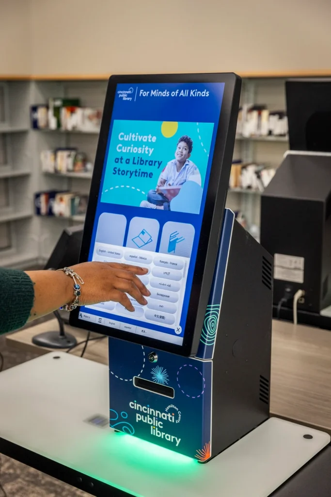 selfCheck 3000 kiosk with quickConnect interface displaying promotional content in a public library