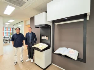 Matthew Bellamy of Bibliotheca and Ubidus CEO Seung Sik Yoon with the Digital Book Kiosk at Ubidus headquarters in Seoul.