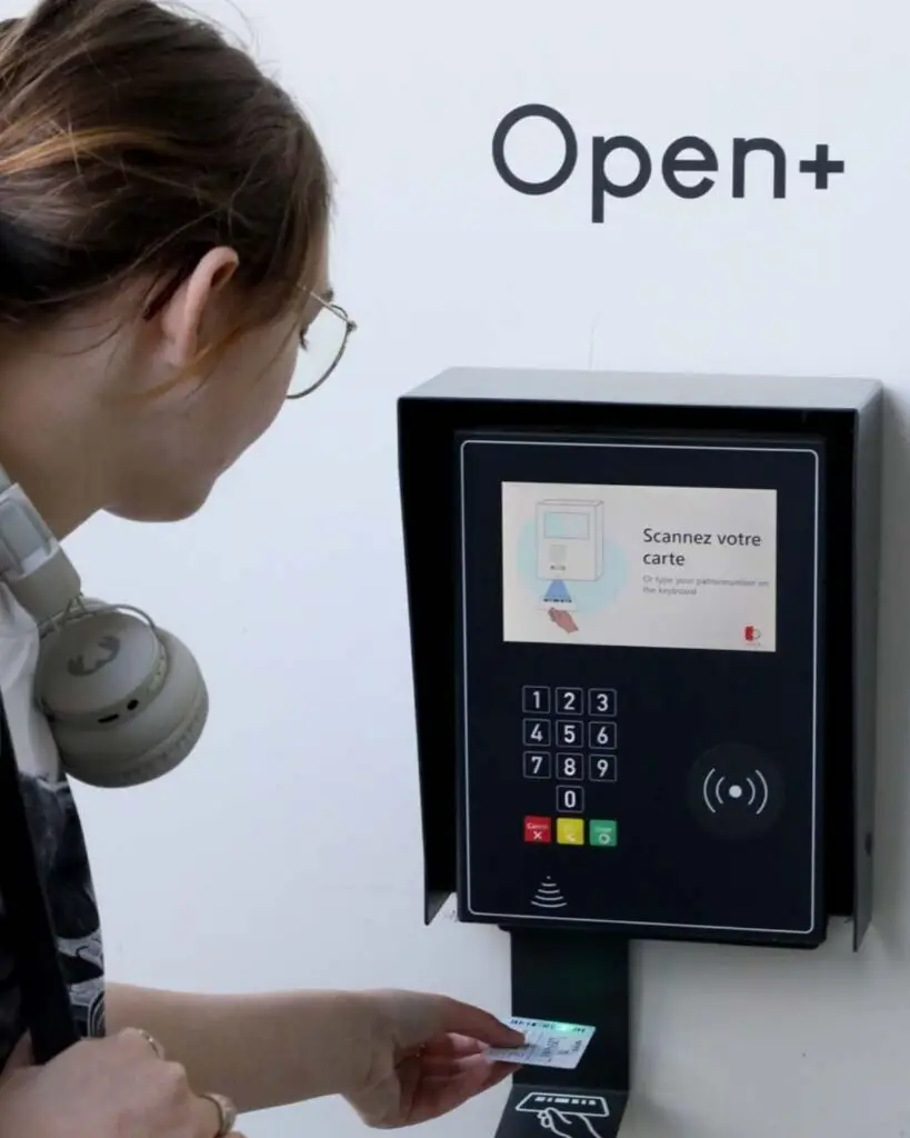 Library user scanning a card to access the building through an extended access control system.