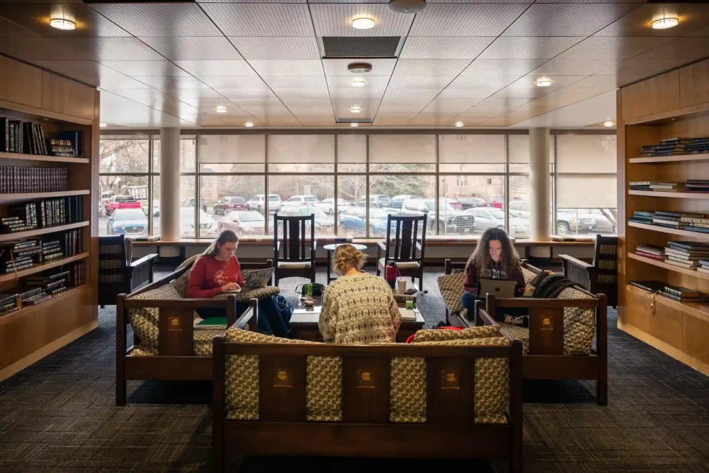 Students studying together in the McMurry Room at University of Wyoming Libraries