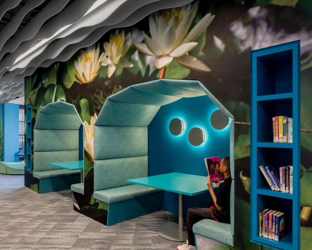 selfCheck + integrated return bins for service-centric success: Redford Township District Library 8 Interactive light wall for children at Redford Township District Library.