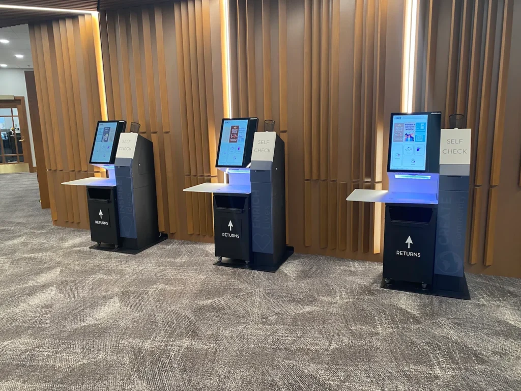 selfCheck + integrated return bins for service-centric success: Redford Township District Library 5 Self-check kiosks with integrated return bins at Redford Township District Library.