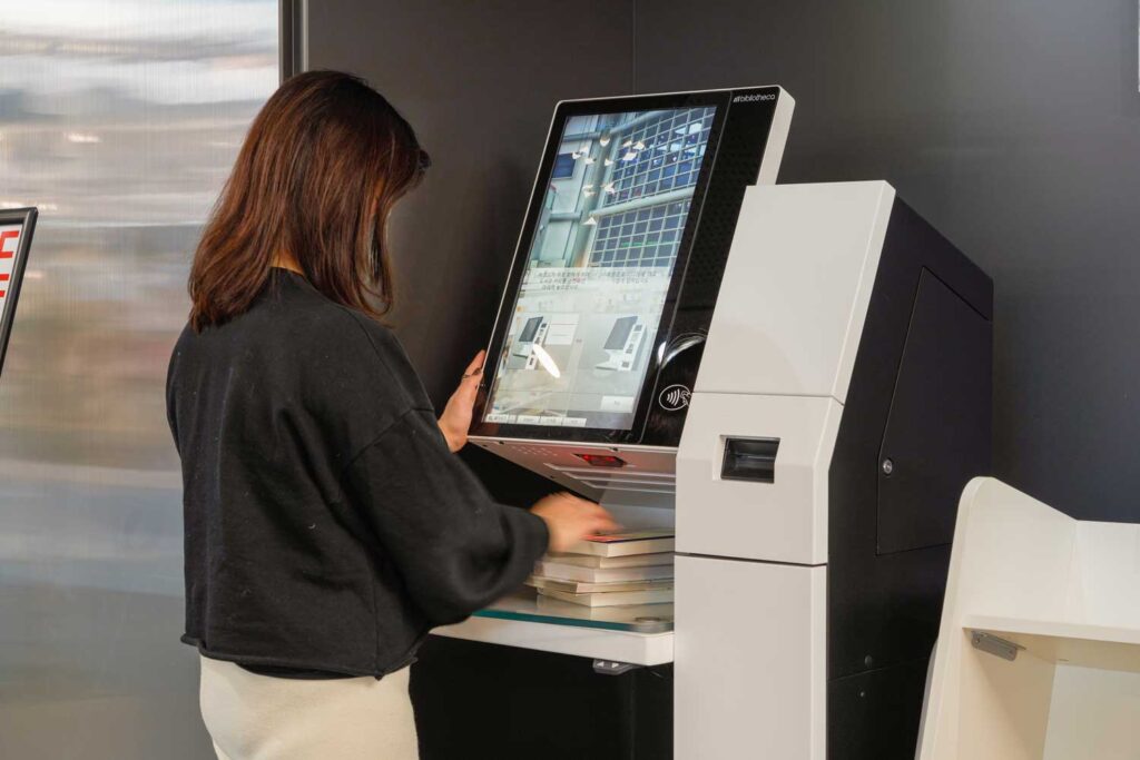 lady using selfCheck1000